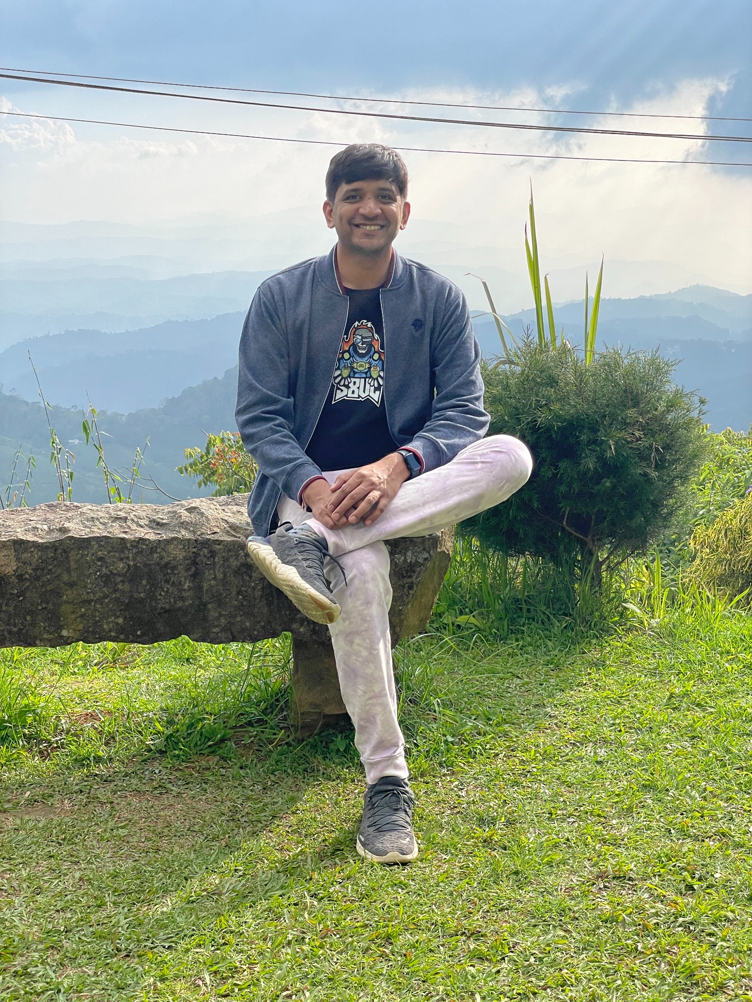 Chetan enjoying a mountain view while travelling